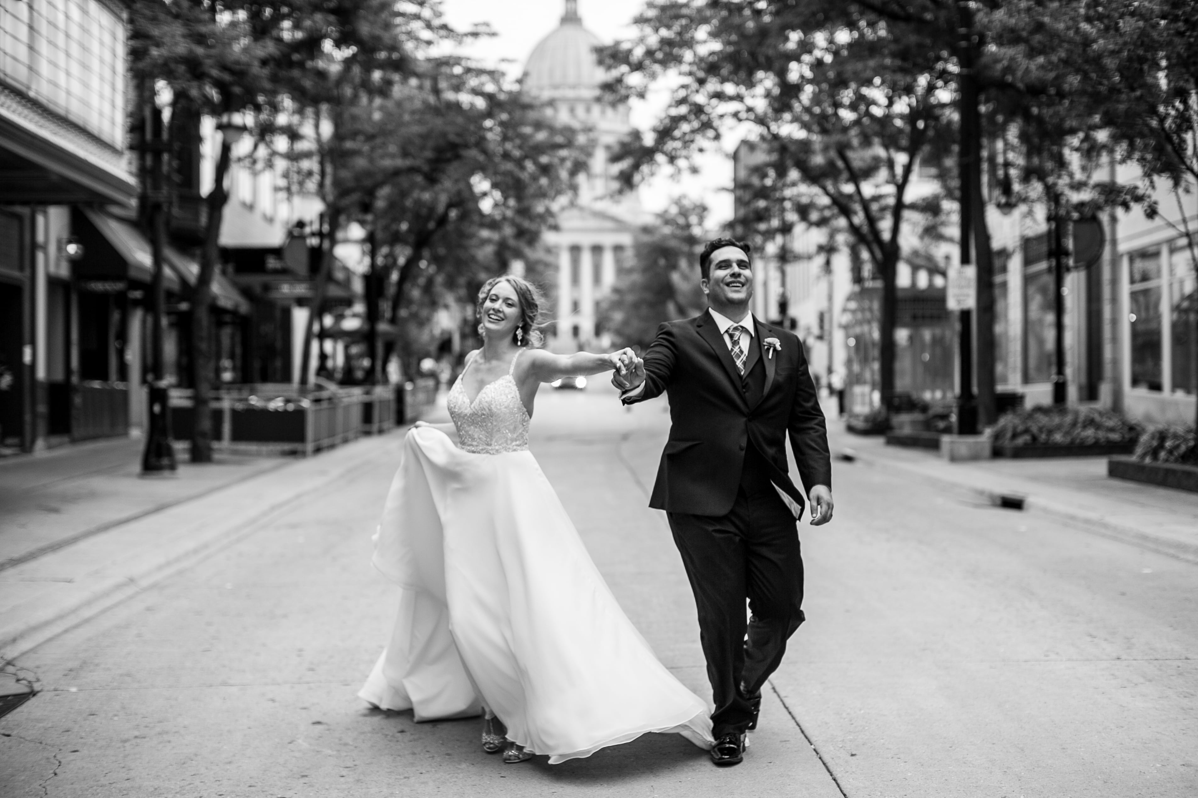 outdoor wedding state street wi state capitol madison wedding photographer wisconsin couple shots goofy fun candid  